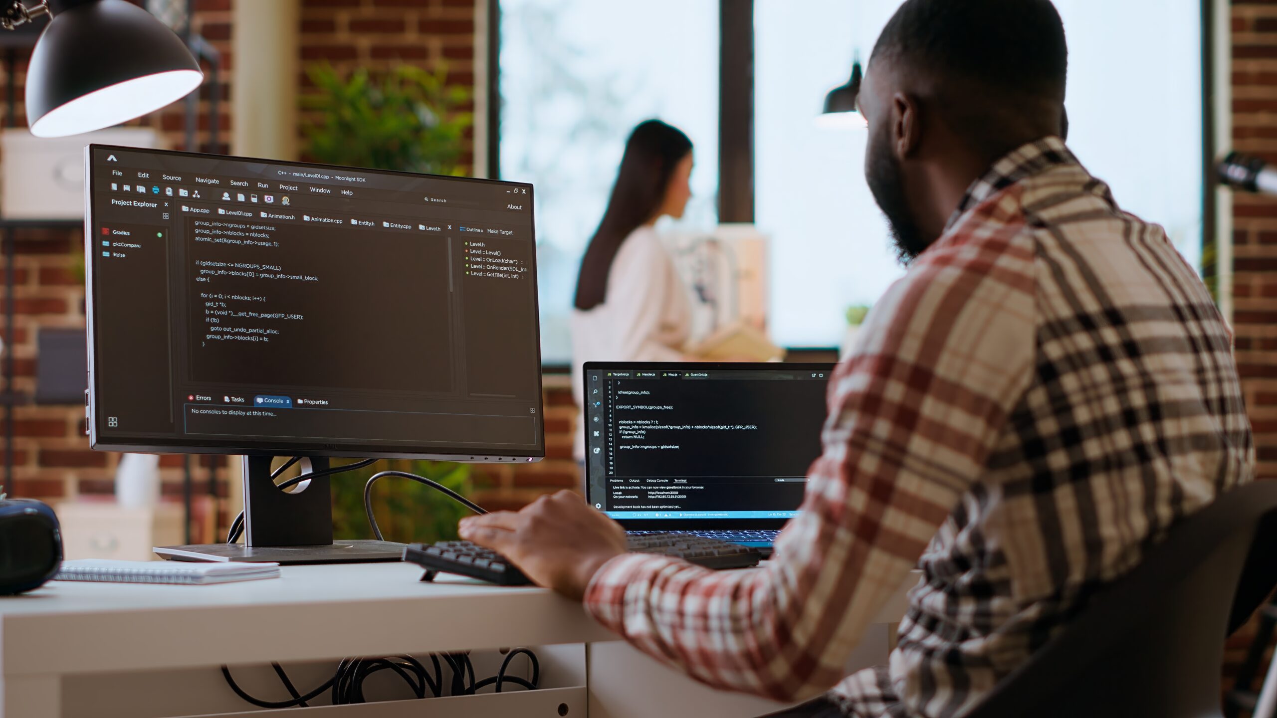 Person coding a website at his desk