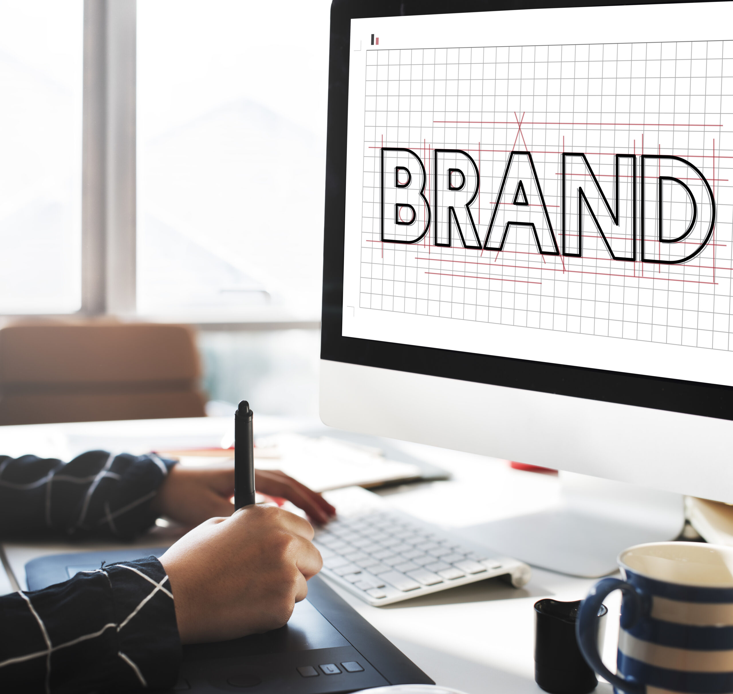 Person creating a brand banner for their graphic design job